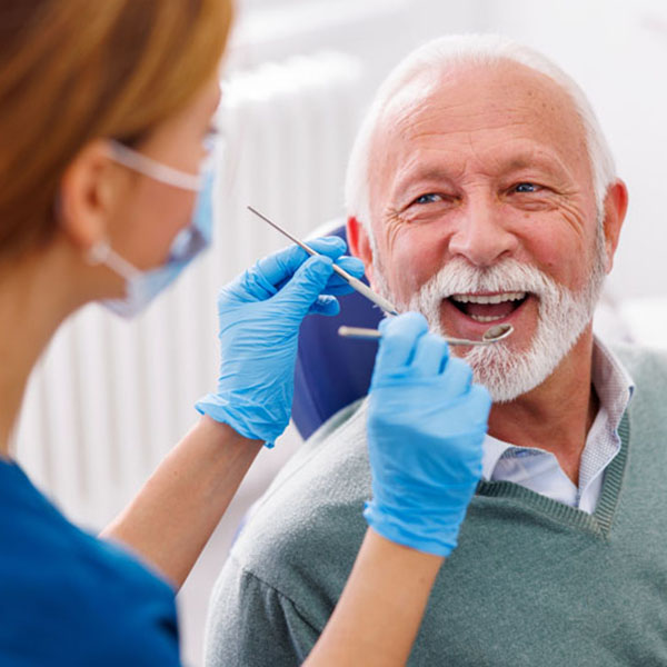 Doctor checking up patient at dentist office Front Desk